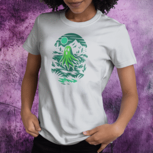 White t-shirt featuring a glowing green ghost drifting through a hollow under a full moon.