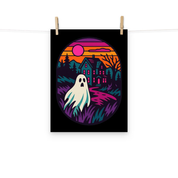 Ghostly Getaway haunted house art print hanging on a plain wall in 12x16 size.