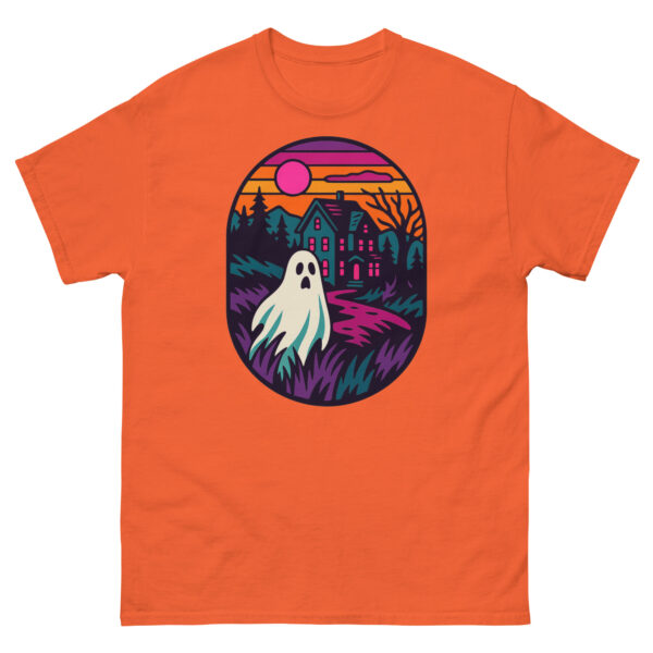 Orange t-shirt with a haunted house and ghost graphic in purples and pinks at sunset.